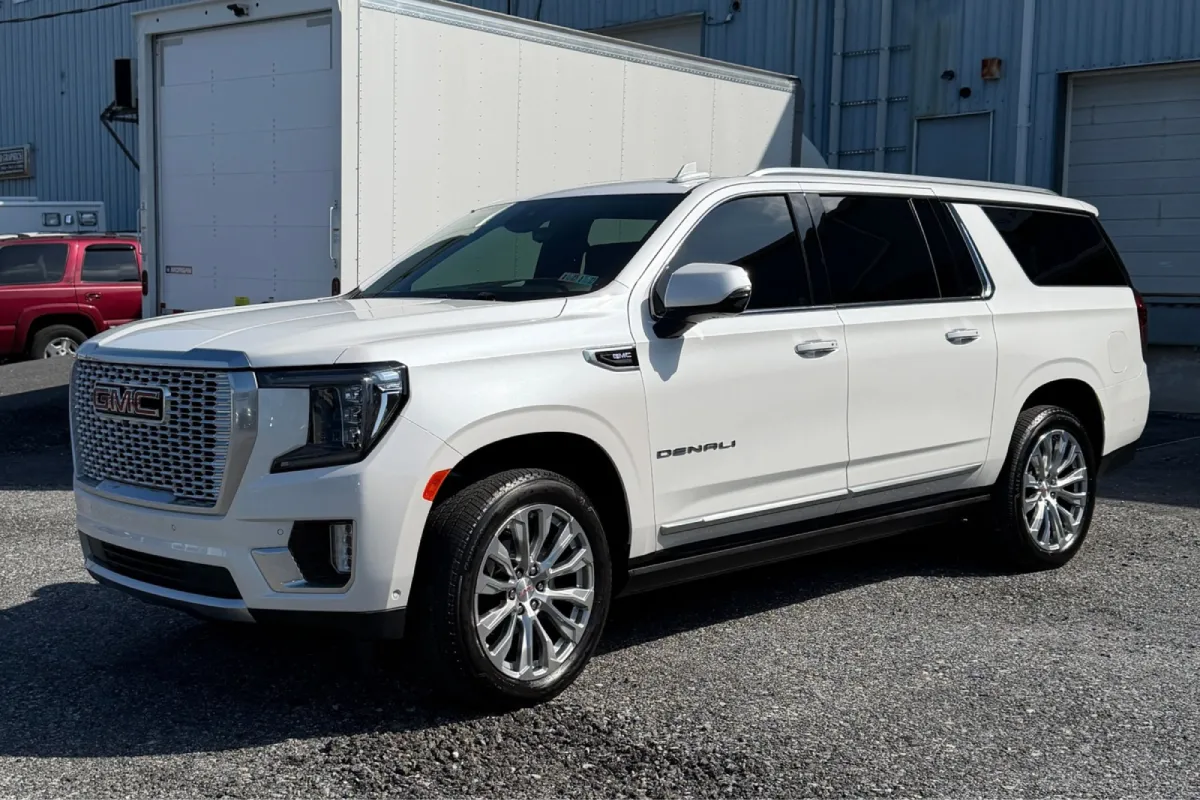 White GMC Denali SUV with glossy ceramic coating.