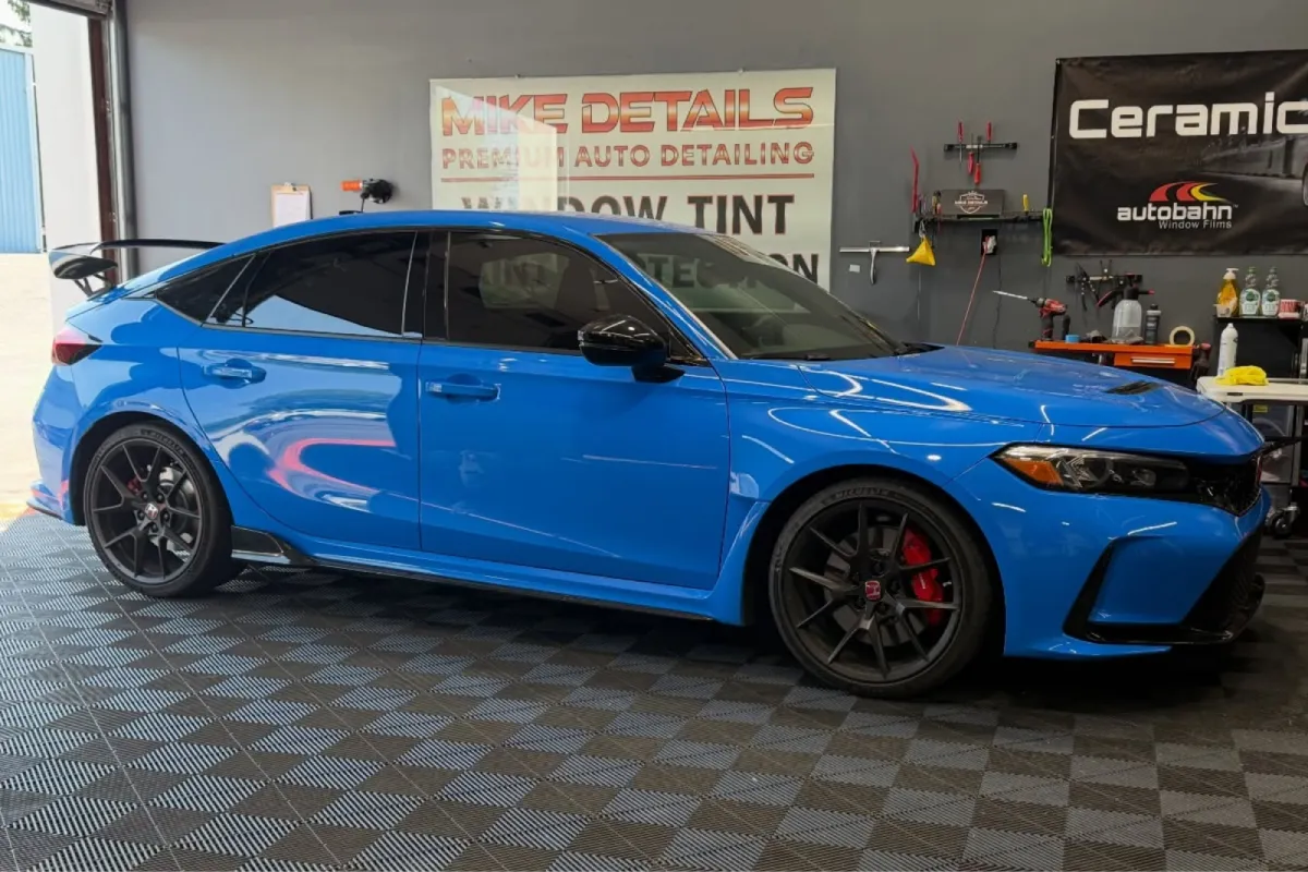 Blue car with paint protection film installed.