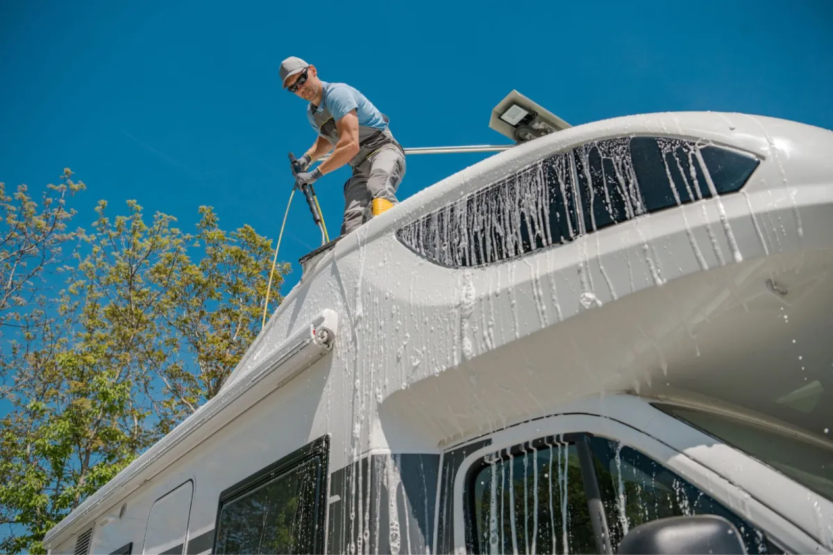 RV exterior being washed with foam during RV detailing.