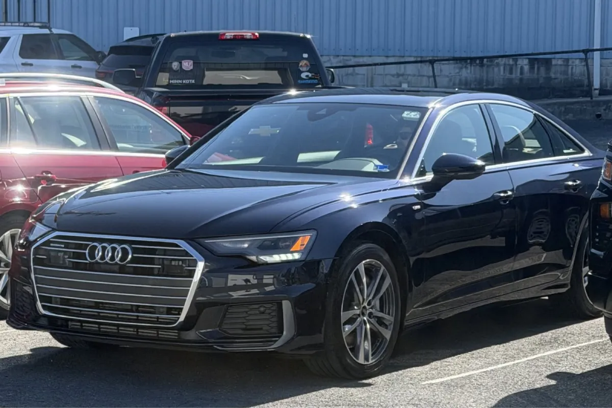 Black Audi sedan with tinted windows.